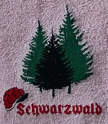 Frotteebox Gästehandtuch Motiv Schwarzwald 50x30cm mit Stickerei Tannenbäume und Bollenhut (weiß)